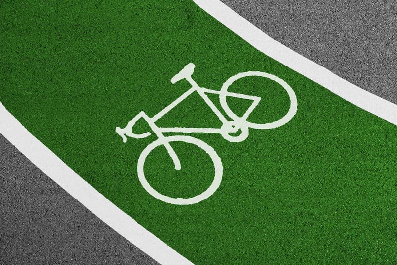 White bicycle pictogram painted on a green German cycle lane